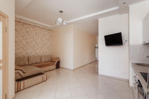 Televízia a/alebo spoločenská miestnosť v ubytovaní Siesta Arkadia Apartament