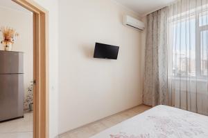 Televízia a/alebo spoločenská miestnosť v ubytovaní Siesta Arkadia Apartament