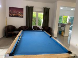 a pool table in a living room at Apartments Ana & Ita in Novalja