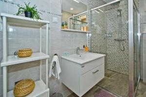 a bathroom with a toilet and a sink and a shower at Apartments and Rooms Marija in Hvar