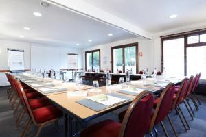 a large conference room with a long table and chairs at Campanile Lille Sud - Douai Cuincy in Cuincy