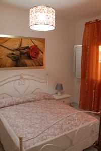 A bed or beds in a room at Salento Roots Apartment