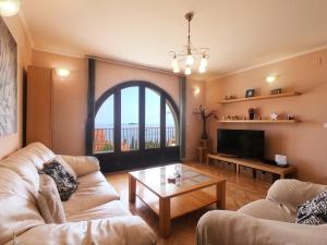 a living room with two couches and a table at Apartments La Perla in Mlini