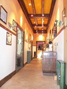 a hallway in a building with a room with a room at Ermitage de Peyreleau in Peyreleau