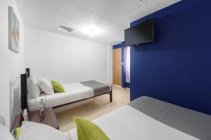 Postel nebo postele na pokoji v ubytování Hotel Casa Normandia