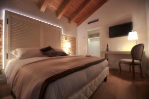 Postel nebo postele na pokoji v ubytování Agriturismo Villa Trovatore