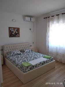 Postel nebo postele na pokoji v ubytování Casa Prifti