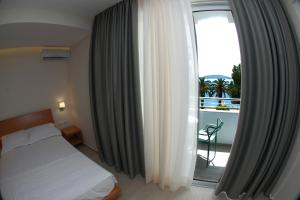 Postel nebo postele na pokoji v ubytování Hotel Ari 2