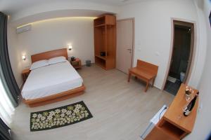 Postel nebo postele na pokoji v ubytování Hotel Ari 2