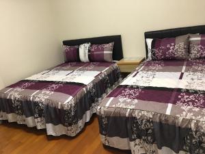 Postel nebo postele na pokoji v ubytování Hong Guo Homestay
