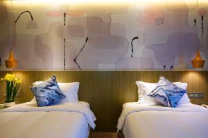 Paco Hotel Tianpingjia Metro Guangzhou - Free Shuttle Bus For Canton Fair客房内的一张或多张床位