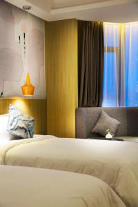 Paco Hotel Tianpingjia Metro Guangzhou - Free Shuttle Bus For Canton Fair客房内的一张或多张床位