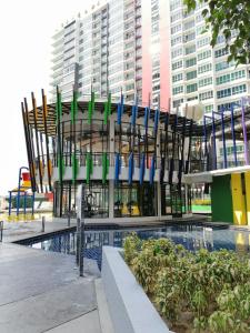 a building with a pool in front of a building at The Zizz Homestay@Damansara Damai in Petaling Jaya +29 photos