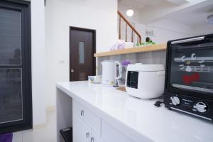 Kuchyň nebo kuchyňský kout v ubytování TiAmo B&B Yilan