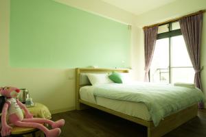 Postel nebo postele na pokoji v ubytování TiAmo B&B Yilan