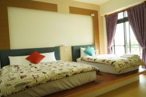 Postel nebo postele na pokoji v ubytování TiAmo B&B Yilan
