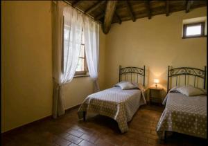 Postel nebo postele na pokoji v ubytování Casetta della Pina