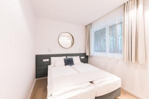 A bed or beds in a room at Oliver Lux