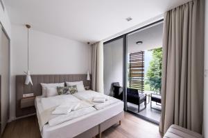 A bed or beds in a room at Oliver Lux