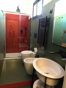 a bathroom with a toilet and a sink and a shower at moon's fault - tutta colpa della luna in Pozzuoli