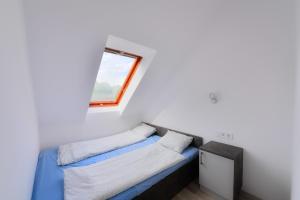 Postel nebo postele na pokoji v ubytování Oliver Inn