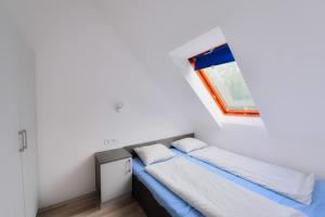 Postel nebo postele na pokoji v ubytování Oliver Inn