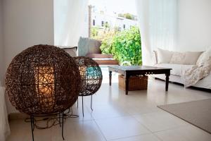 a living room with two chairs and a table at New Opening Villa Oasis Terramar in Sitges