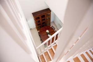 an overhead view of a stairs with a table and a cabinet at New Opening Villa Oasis Terramar in Sitges