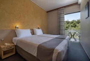 Postel nebo postele na pokoji v ubytování Acropolis View Hotel + 37 fotografií