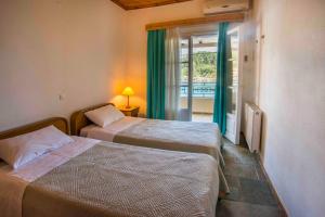 Ένα ή περισσότερα κρεβάτια σε δωμάτιο στο Villa Gaia
