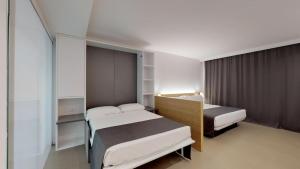 Posteľ alebo postele v izbe v ubytovaní Gran Hotel Reymar 4 Sup