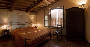 Posteľ alebo postele v izbe v ubytovaní Bio Agriturismo Il Melograno di Banditella Ristorante + 37 fotografií