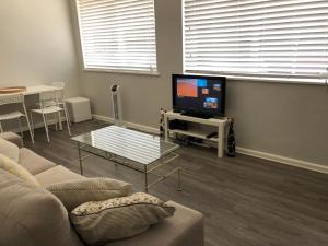 
A television and/or entertainment center at 1 Bedroom Unit in Heart of Elsternwick
