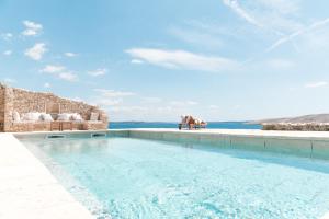 a swimming pool with a view of the ocean at Holiday home Sika in Miškovići