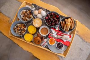 a tray of breakfast foods on a table at Agrikea in Korissia