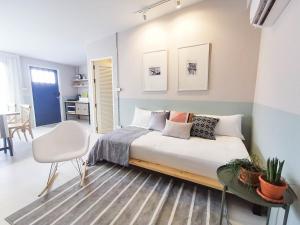 Postel nebo postele na pokoji v ubytování Snoozy Guesthouse