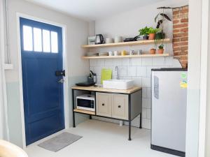 Kuchyň nebo kuchyňský kout v ubytování Snoozy Guesthouse