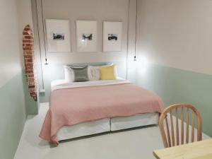 Postel nebo postele na pokoji v ubytování Snoozy Guesthouse