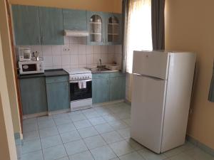 Kuchyňa alebo kuchynka v ubytovaní Sasi Apartmanház + 15 fotografií