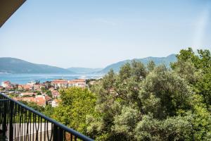 a view of a city from a balcony at Apartment Sea&Sky in Tivat