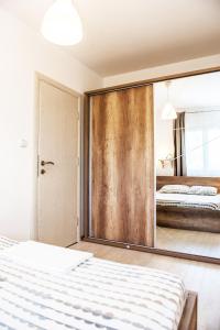 Postel nebo postele na pokoji v ubytování Apartment Sea&Sky