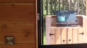 a blue tea kettle sitting on top of a box at Nire Valley Eco Camp in Ballymacarbry
