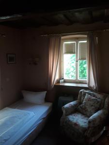 Ein Bett oder Betten in einem Zimmer der Unterkunft Hotel Feiler