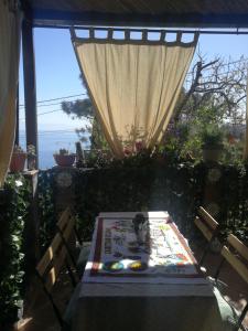 a table with a cake sitting on top of it at Casa donna Fiorella tipica siciliana in Taormina