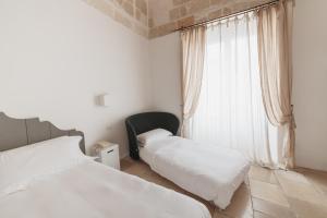 Postel nebo postele na pokoji v ubytování Giovì Relais