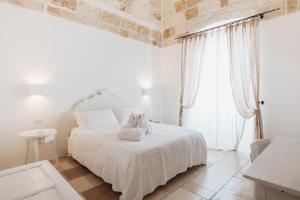 Postel nebo postele na pokoji v ubytování Giovì Relais