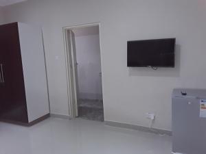 TV a/nebo společenská místnost v ubytování Delight Lodge