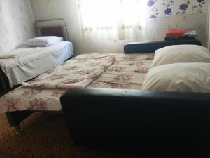 Katil atau katil-katil dalam bilik di Guest House Knarik