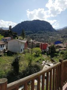 a small town with a mountain in the background at Apartamento en Carreña de Cabrales in Carreña de Cabrales