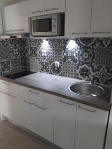 Kuchyňa alebo kuchynka v ubytovaní Bella Apartments